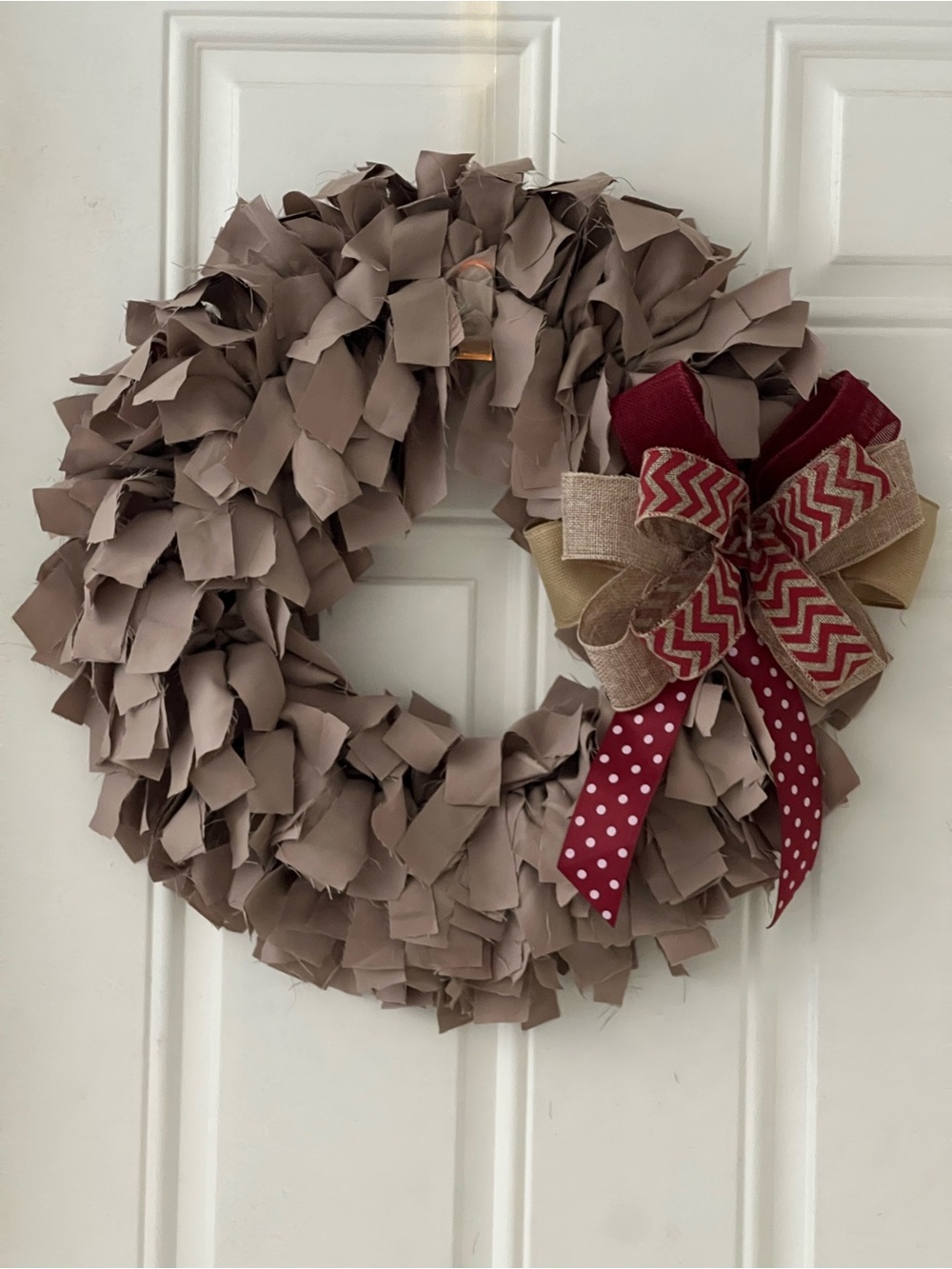 Taupe Decorative Holiday Wreath with Red Accent Bow